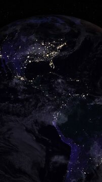 Night side of the Earth with city lights. Zoom in America countries. Vertical video. Elements of this image furnished by NASA