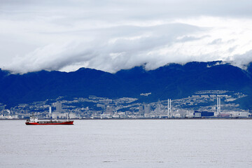 A cityscape of Kobe city, overlooking the high-end residential area surrounded by Mount Rokko from the coastline
