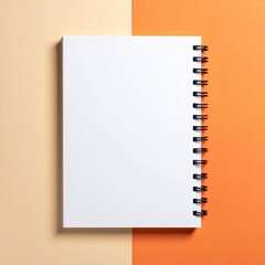 Blank spiral-bound notebook on a two-tone background