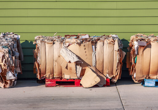 Cardboard boxes sitting on pallets ready for recycling