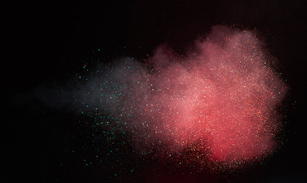 Red smoke with teal sparkles on black background, voluminous coral‑crimson cloud bursting with scattered turquoise particles, vibrant abstract atmospheric vapor and dust explosion

 - Powered by Adobe