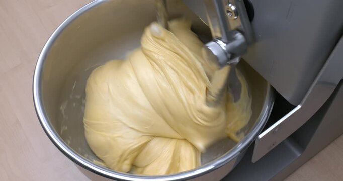 mixing panettone dough in a twin‑arm mixer