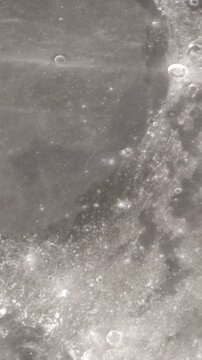 Camera flies around a craters in the Moon in Apollo 17 landing site. Vertical video. Elements of this image furnished by NASA's Scientific Visualization Studio.