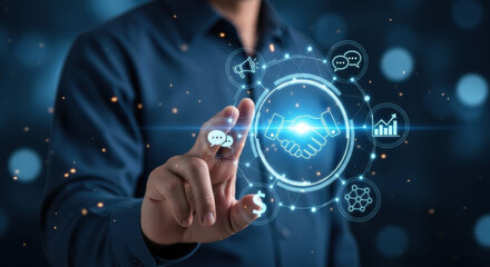 A man in a blue shirt interacts with a glowing digital interface displaying business and technology icons against a dark, bokeh-lit background.