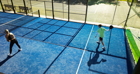People, padel and team training with racket, above and practice for competition at tennis court. Athlete, partner and game strategy with double challenge, workout and sports at fitness club in summer
