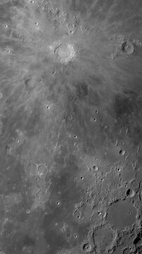 Camera flies around a craters in the Moon. Vertical video. Elements of this image furnished by NASA's Scientific Visualization Studio.