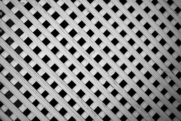 Photo of the wooden lattice of the veranda window wooden pattern grid diamond. Texture or background for the design.