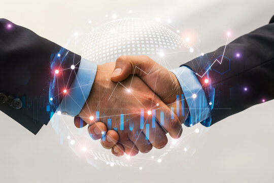 Global business partnership agreement represented by two hands shaking and overlaid with data and financial growth charts - Powered by Adobe