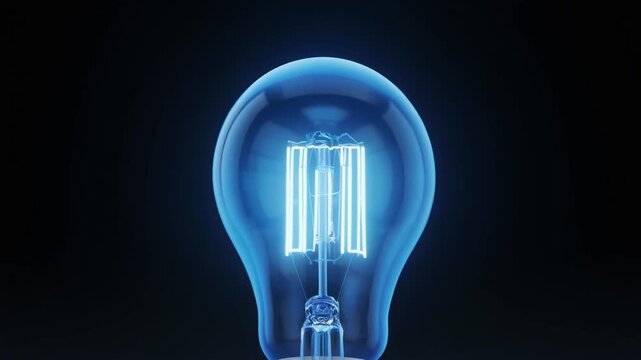 Glowing blue light bulb with visible filament and clear glass against dark background, symbolizing innovation and energy.