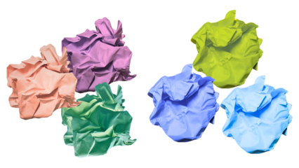 studio photograph featuring an array of vibrant crumpled paper balls in various colors, ideal for symbolizing creative chaos and innovation