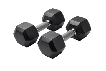 Black dumbbells resting on a white surface after a workout session in a home gym during afternoon hours