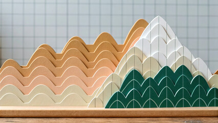 Layered wooden mountain decor with pastel and green colors, geometric shapes, and playful design for modern interior style