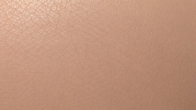 Close up macro shot of human skin texture with subtle color variations and pores.