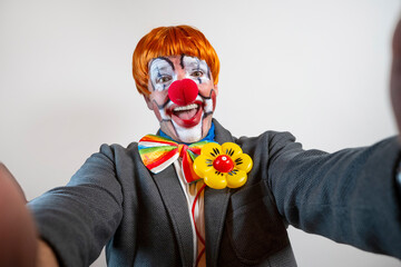 Happy clown man making a selfie, smiling