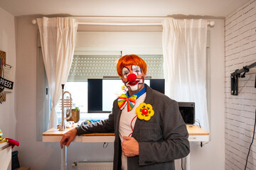 Clown performer in everyday suit working from home