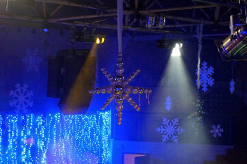 new year party in night club with xmas decoration and snowflakes, background