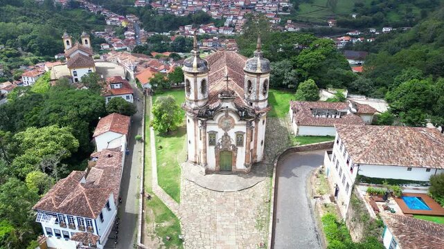 Ouro Preto, Brazil: Aerial drone footage of Church of Saint Francis of Assisi in middle of Ouro Preto colonial old town, state in Minas Gerais , Brazil. Taken with backward motion