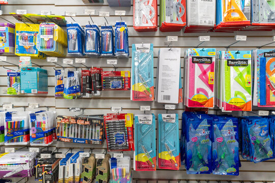 Colima, Colima, Mexico. December 7, 2025: Assortment of stationery items hanging on the store wall. Display shelves.