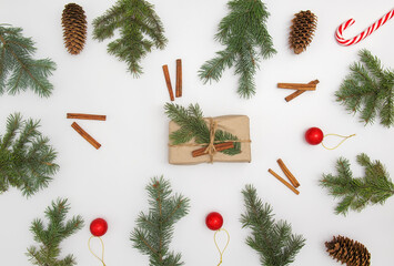 Christmas flat lay styled scene with evergreen fir tree, decorations and present box