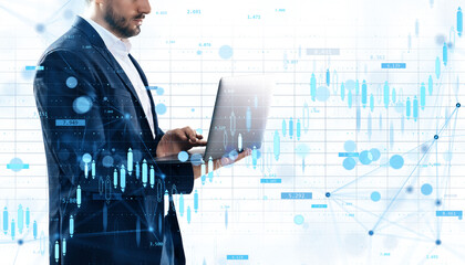 Businessman using laptop with digital forex and currency market chart elements, isolated on white background, concept of data analysis