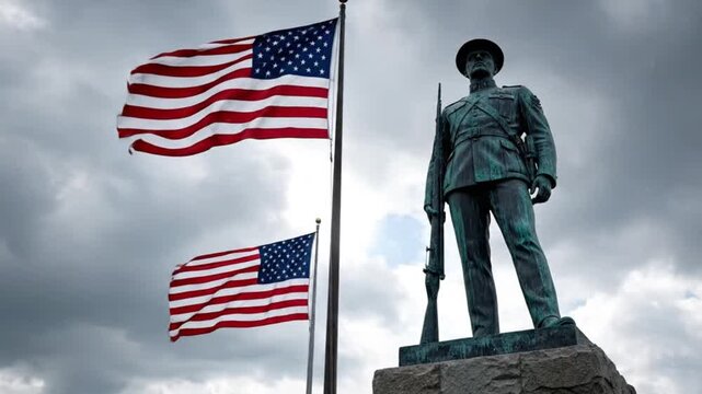 American Soldier Memorial Statue with Waving United States Flags Against Dramatic Sky Honoring Military Service Freedom and National Pride