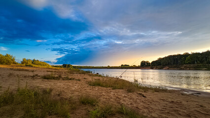 Sunset on the cloudy river.