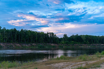 Sunset on the cloudy river.