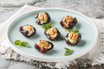 Dates stuffed with cream cheese, walnuts and honey