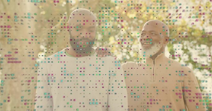 Senior placing hand on son's shoulder, supporting health while son smiling under pixel dot overlay