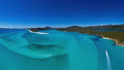 Aerial view of Hill Inlet at high tide with speedboat
