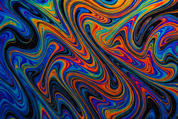 Obraz premium Vibrant rainbow oil spill background with liquid ripples and neon reflections