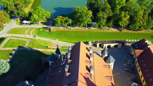 Nesvizh Castle - a top view of a medieval castle in autumn, Belarus. A landscape with a palace surrounded by a moat on a sunny autumn day. The Radziwill Family Castle from a bird's-eye view. 4К