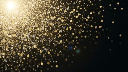 Golden confetti particles scattered on a dark background with a bright light source