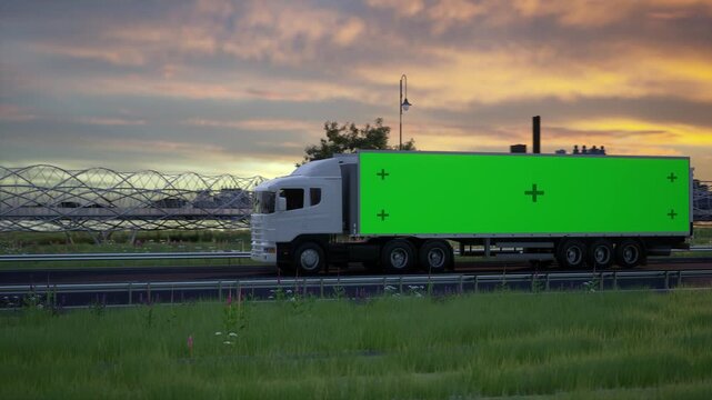 White Semi Truck Driving on Highway at Sunset with Green Screen Trailer for Advertisement Mockup