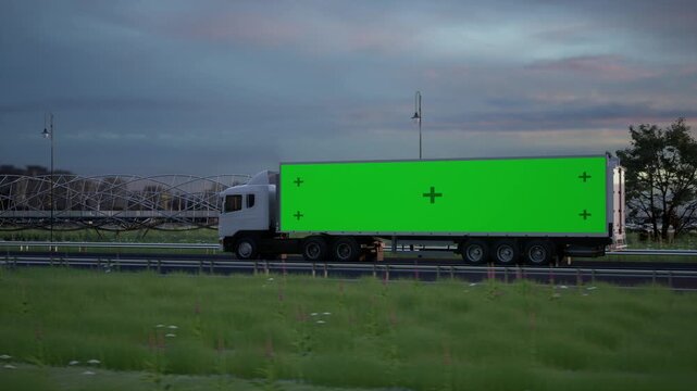 White Semi Truck Driving on Highway at Sunset with Green Screen Trailer for Advertisement Mockup