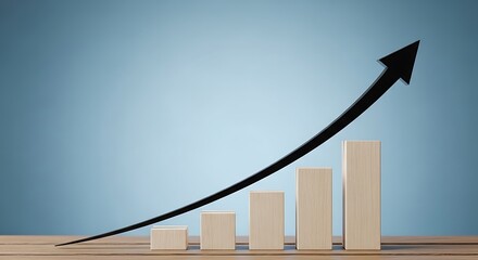 A rising arrow graph made of wooden blocks on a table, indicating growth and success