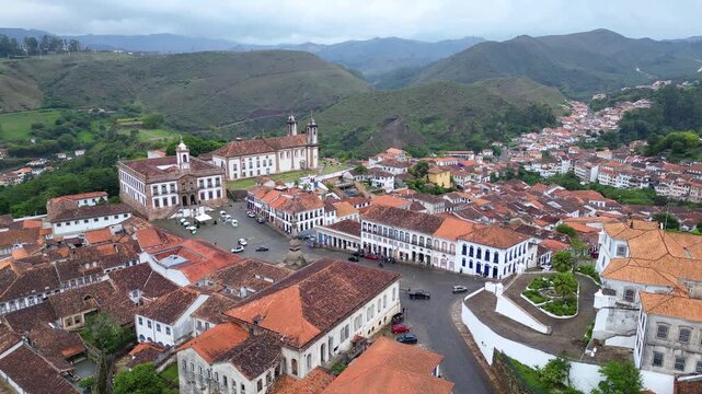 Ouro Preto, Brazil: Aerial drone footage of Tiradente museum situated in Ouro Preto townsquare, old town of Brazil with the museum and Bas&iacute;lica Nossa Senhora do Pilar in the center. WIth the mou