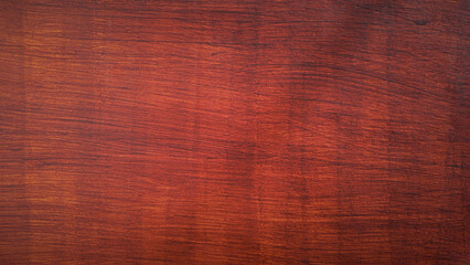 Reddish brown wood texture background, polished wooden surface with natural grain pattern for interior design.