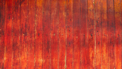 Vintage red wooden wall texture background, rustic vertical wood plank surface with natural grain.