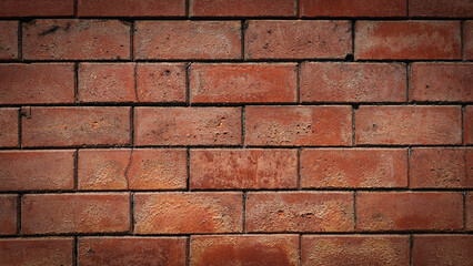 Dark red brick wall texture background with vignette, vintage rustic masonry surface for industrial design