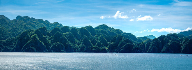 Breathtaking sea and lansdcapes with stunning rock formations covered in lush tropical vegetation surrounded by turquoise waters and coral reefs, Coron, Palawan, Philippines