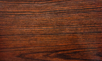 A photo of the mahogany texture.Antique tabletop top view.Dark wooden background.