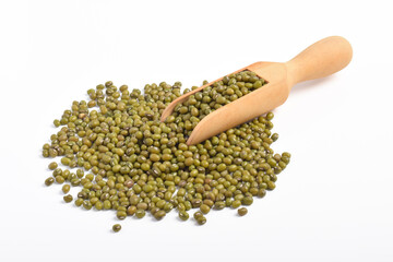 Raw mung beans on a wooden shovel isolated on a white background.