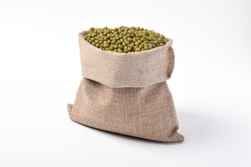 Raw mung beans in a sack isolated on a white background. Burlap sack