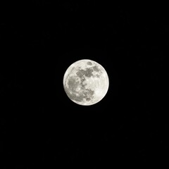 Obraz premium A stunning, high-resolution view of a perfectly illuminated full moon centered against a deep, dark, starless void of the cosmos ,circle ,darkness ,light