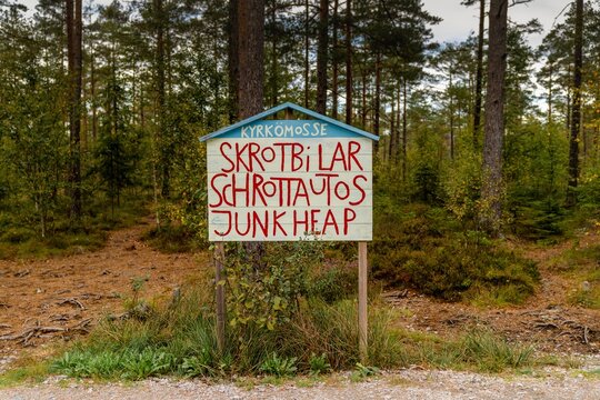 view of the sign at the entrance of the Kirkomosse Car Cemetery near Ryd in southern Sweden