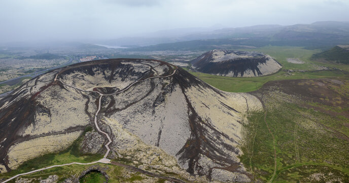 drone panorama view of the Grabrok volcanic crater with stairs and viewing platform in northwestern Icleand