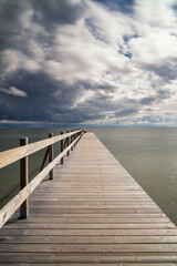 Obraz premium view of the Falsterbo Brygga bathing facility pier on the Baltic Sea shore of southern Sweden