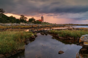 view of the historic red brick Svaneke Lighthouse on the east coast of the Danish island of Bornholm