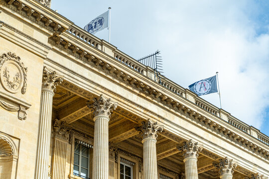 Paris, France - October 30, 2025: Flag FIA on building street Entrance to headquarters of International Automobile Federation FIA in Paris. Sign banner under door